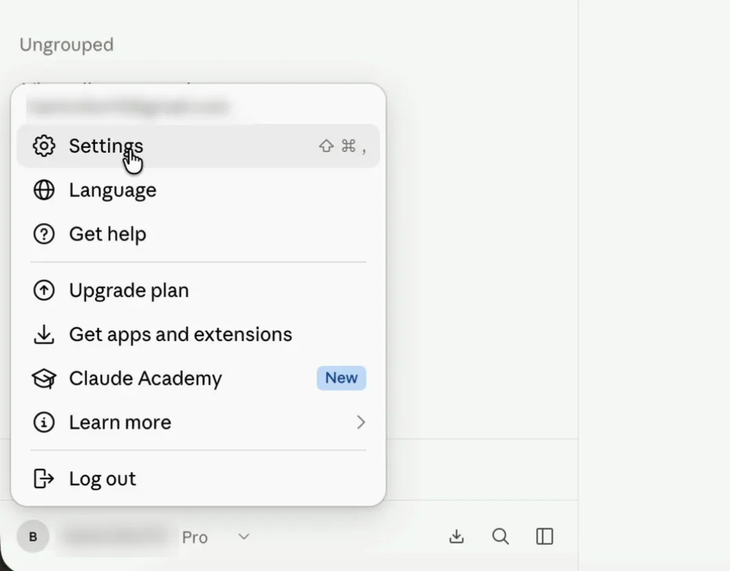 The Claude.ai account menu opened from the bottom-left of the sidebar, with Settings at the top of the list.